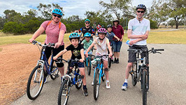 Family bike riding group at a WA Bike Month event