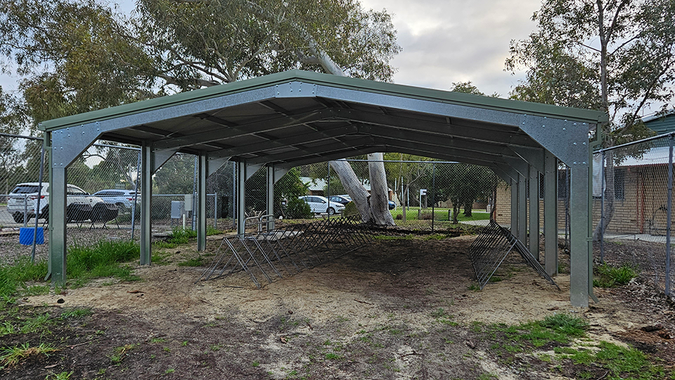 Constructed bike shelter with bike racks at Bramfield Park Primary School