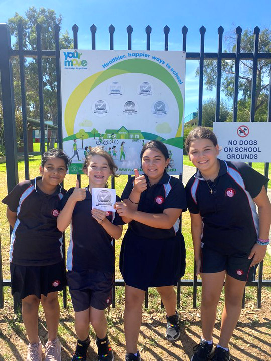 Students from Phoenix Primary School with their Your Move accreditation badge.