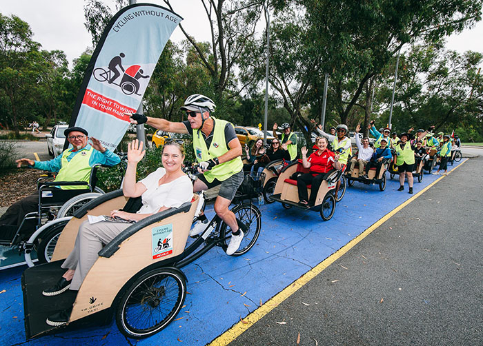 Conference attendees enjoying trishaw rides